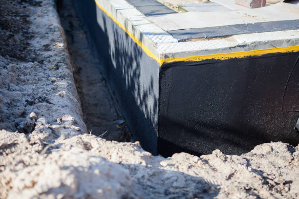 Professional Waterproofing technician working in Triangle, VA